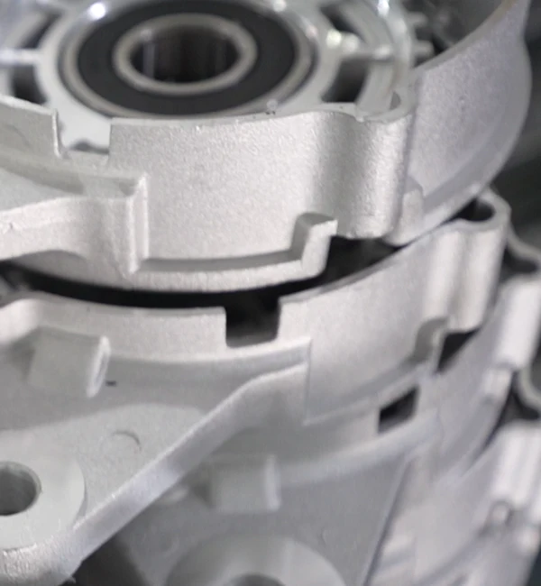 Alternator housing mounting features and bearing-side opening