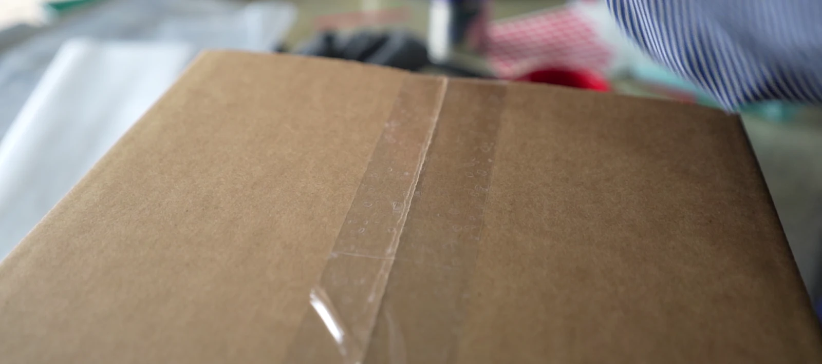Carton handling. Cropped from original footage; no model or fitment claim.