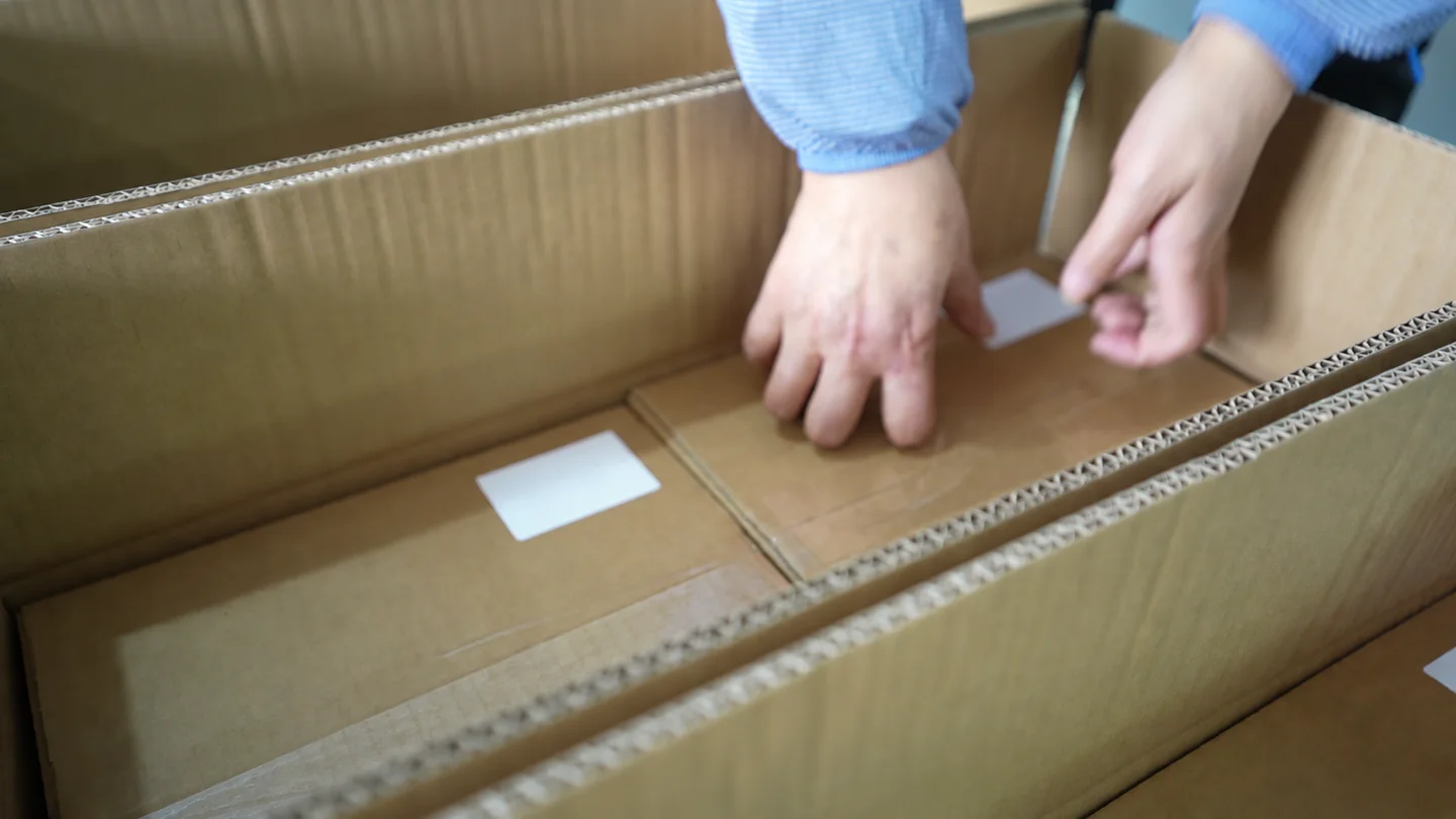 Individual cartons being placed inside an outer shipping carton